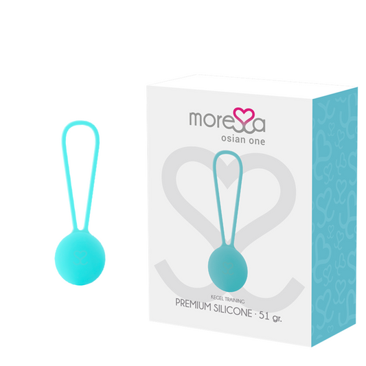 Turquoise silicone training aid with packaging on a white background