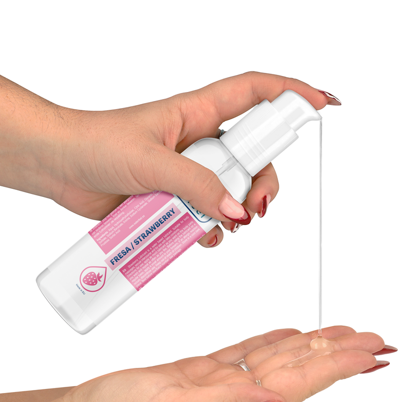Hand holding a strawberry-scented spray bottle with a white background