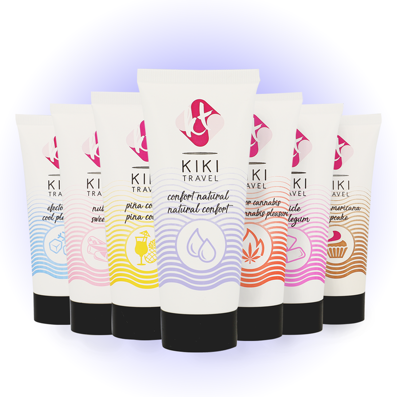 Row of KIKI Travel product tubes with colorful labels on a white background
