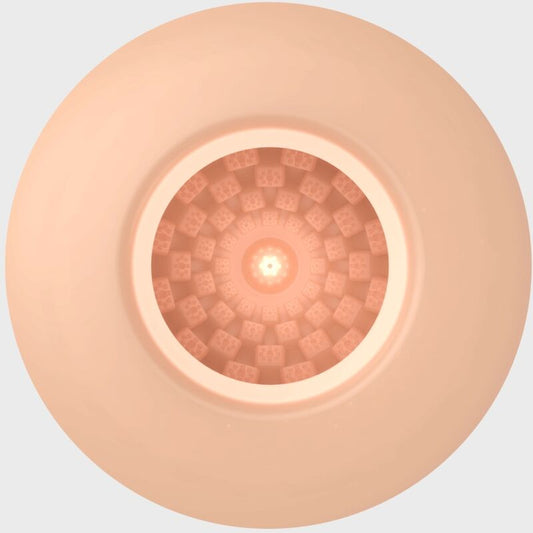 Close-up of a beige circular object with a textured pattern on a light gray background