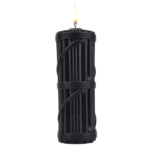 Black textured candle with lit flame, romantic ambiance by WELLWETTA