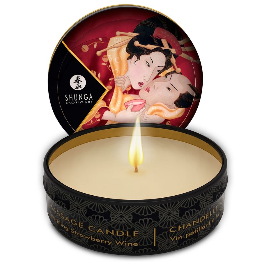 Shunga candle in a decorative tin with a flame