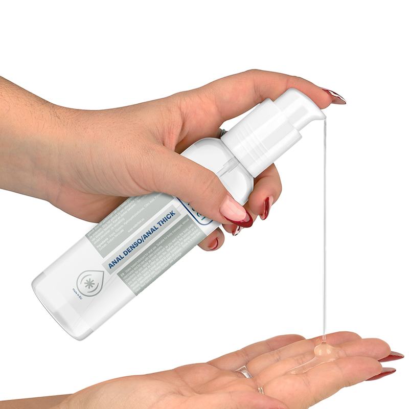 Hand holding a white spray bottle with product being dispensed onto another hand against a white background