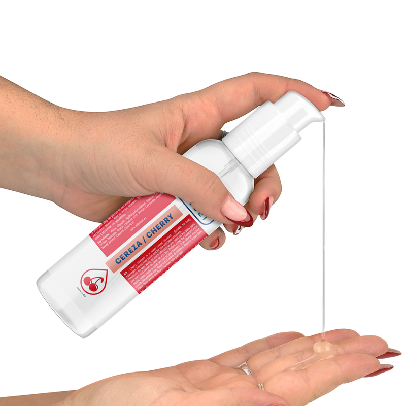 Hand holding a Cereza Cherry spray bottle with a white background