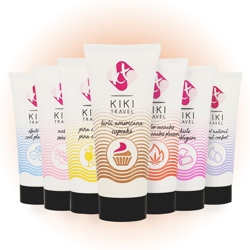 Set of KIKI Travel skincare products with colorful labels on a gradient background