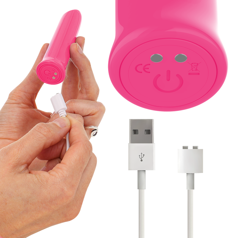 Pink electronic device with USB cable and hand holding it on a white background