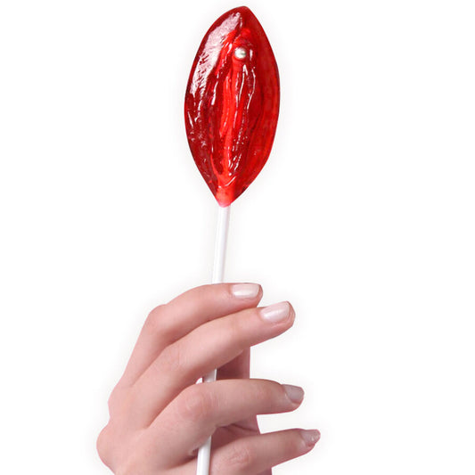 Hand holding a red lollipop against a white background