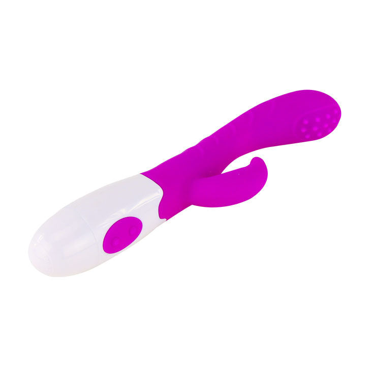 Purple and white baby spoon on a white background