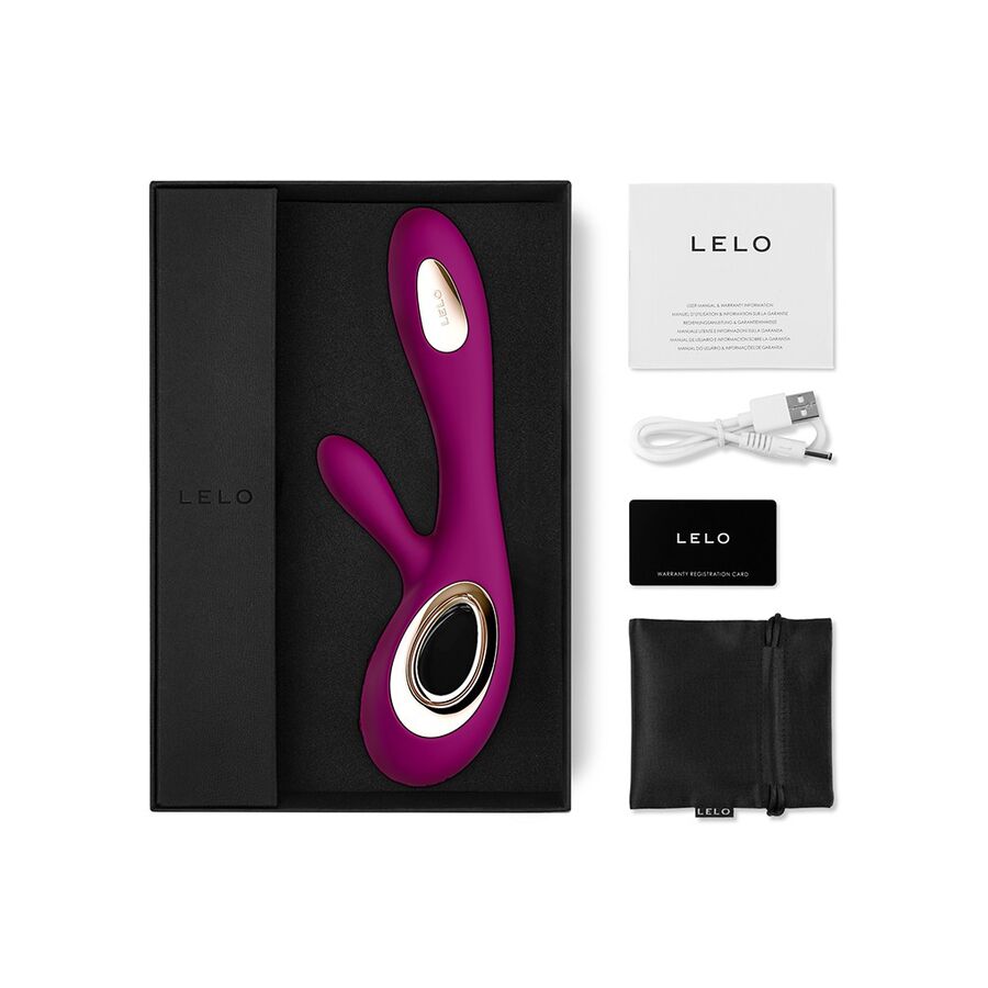 Purple electronic device with gold accents in a black box, accompanied by LELO branding and accessories on a white background.